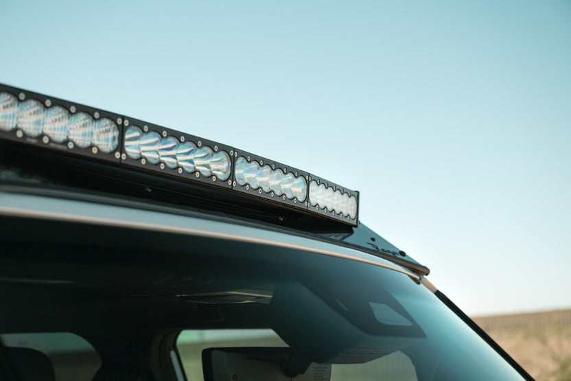 A light bar installed to a Land Cruiser Roof Rack.