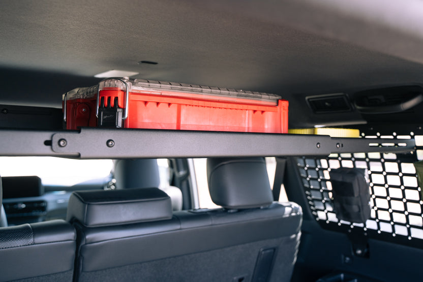 Toolbox on the Molle Panel Storage Shelf for the 2024 Toyota Land Cruiser in high-position